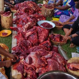 Ladies cutting up the newly slaughtered beef