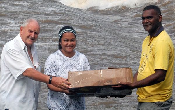 Carrying the altar cloth after the trip across the river