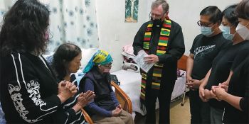 Fr. Larry Barnett with Granny MaHong, seated wearing head scarf